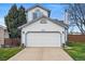 Charming home exterior with two-car garage and well-maintained front yard at 9521 Joyce Ln, Highlands Ranch, CO 80126