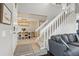 Inviting foyer with staircase leading to dining room and living room at 9521 Joyce Ln, Highlands Ranch, CO 80126