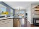 The kitchen boasts stainless steel appliances and opens to the dining area with access to a patio at 9521 Joyce Ln, Highlands Ranch, CO 80126
