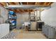 Basement laundry room with a washing machine, dryer, sink, shelving, freezer and a patterned rug at 9521 Joyce Ln, Highlands Ranch, CO 80126
