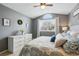 Well-lit main bedroom with neutral walls, large window, and a comfortable bed at 9521 Joyce Ln, Highlands Ranch, CO 80126