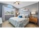 Serene main bedroom with neutral walls, a large window, and tasteful decor at 9521 Joyce Ln, Highlands Ranch, CO 80126