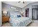 Cozy main bedroom featuring neutral colors, two nightstands, and a spacious closet at 9521 Joyce Ln, Highlands Ranch, CO 80126