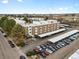 Apartment building with covered parking, mature trees, and beautiful landscaping from above at 384 S Ironton St # 408, Aurora, CO 80012