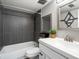 Well-lit bathroom with modern fixtures, sleek gray tile, and a stylish vanity at 384 S Ironton St # 408, Aurora, CO 80012