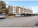 Multi-story apartment complex with ample parking at 384 S Ironton St # 408, Aurora, CO 80012