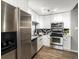 Updated kitchen features stainless steel appliances, sleek cabinets, and modern finishes at 384 S Ironton St # 408, Aurora, CO 80012