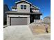 Charming two-story home with stone accents, a two-car garage, and a welcoming front porch at 739 N Deer Park St, Watkins, CO 80137