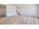 Spacious living room featuring hardwood floors, white walls, a staircase, and bright natural light at 739 N Deer Park St, Watkins, CO 80137