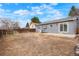 Large backyard with a patio area, partial fencing, and potential for landscaping at 3643 S Mobile Way, Aurora, CO 80013
