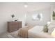 Cozy bedroom features soft carpet, natural light, and neutral decor at 3643 S Mobile Way, Aurora, CO 80013
