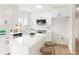 Updated kitchen with white cabinets, stainless steel appliances, and a stylish island with seating at 3643 S Mobile Way, Aurora, CO 80013