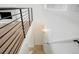 Bright stairway features modern railing, natural light, and leads to a cozy living area at 3643 S Mobile Way, Aurora, CO 80013