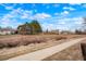 Yard and pathway in a residential neighborhood, showing the natural surroundings at 3643 S Mobile Way, Aurora, CO 80013