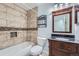 Bathroom featuring tiled shower-tub, vanity with sink and mirror at 18347 E Nassau Dr, Aurora, CO 80013