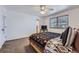 Cozy bedroom with a patterned bedspread and large window for natural light at 18347 E Nassau Dr, Aurora, CO 80013