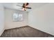 Spare bedroom featuring neutral carpet, ceiling fan, and window with blinds at 18347 E Nassau Dr, Aurora, CO 80013