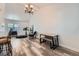 Inviting living room featuring stylish furnishings, wood-look flooring and ample natural light at 18347 E Nassau Dr, Aurora, CO 80013