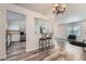 Bright, open floor plan connecting the living room and kitchen, featuring wood-look floors and modern fixtures at 18347 E Nassau Dr, Aurora, CO 80013