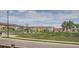 View of a well-maintained neighborhood green space surrounded by residential townhomes at 4343 E 96Th Way, Thornton, CO 80229