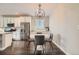 Dining area featuring hardwood floors, modern lighting and ample natural light at 4343 E 96Th Way, Thornton, CO 80229