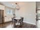 Dining space featuring hardwood floors and an industrial-style light fixture at 4343 E 96Th Way, Thornton, CO 80229