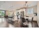 Open kitchen and dining area featuring modern stainless steel appliances and hardwood floors at 4343 E 96Th Way, Thornton, CO 80229