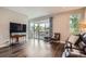 Comfortable living room featuring dark floors, sliding glass doors to deck and modern décor at 4343 E 96Th Way, Thornton, CO 80229