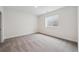 Carpeted basement bedroom with window at 5537 Riverbend Ave, Firestone, CO 80504