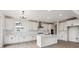 Contemporary kitchen featuring white cabinetry, sleek countertops, and stainless steel appliances at 5537 Riverbend Ave, Firestone, CO 80504