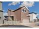 Beautiful two-story home showcasing a modern design with a private backyard and garage at 6209 Stable View St, Castle Pines, CO 80108