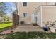Charming back porch offers a peaceful outdoor retreat with a well-maintained yard at 3121 S Estes St, Lakewood, CO 80227