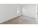 Bedroom featuring neutral carpet and one window offering plenty of natural light at 3121 S Estes St, Lakewood, CO 80227