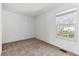 Bedroom featuring neutral carpet and one window offering plenty of natural light at 3121 S Estes St, Lakewood, CO 80227