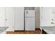 Kitchen features granite countertops, white appliances, and ample storage space at 3121 S Estes St, Lakewood, CO 80227