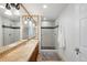 Bathroom features a double sink vanity, a glass enclosed shower with custom tile, and stylish fixtures, providing a luxurious feel at 10914 Remmick Ridge Rd, Parker, CO 80134