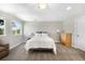 Well-lit bedroom features a comfortable bed, neutral color scheme, large window, and ample space for furniture and relaxation at 10914 Remmick Ridge Rd, Parker, CO 80134