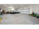 Spacious garage featuring ample room for multiple vehicles, storage, and large garage doors at 10914 Remmick Ridge Rd, Parker, CO 80134