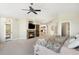 Comfortable main bedroom featuring a cozy fireplace, balcony access, and seamless transition to the ensuite bathroom at 10914 Remmick Ridge Rd, Parker, CO 80134
