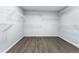 Large walk-in closet with modern hardwood floors and shelving storage space at 1963 Hogan Ct, Castle Rock, CO 80109