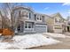 Charming two-story home with a covered front porch, shutters, and a two-car garage at 1963 Hogan Ct, Castle Rock, CO 80109