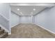 Spacious finished basement with recessed lighting and neutral carpet flooring at 1963 Hogan Ct, Castle Rock, CO 80109