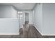 Hallway featuring neutral paint and hardwood flooring leading to multiple rooms at 1963 Hogan Ct, Castle Rock, CO 80109
