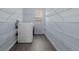 Laundry room with wire shelving, utility sink, and a modern washing machine at 1963 Hogan Ct, Castle Rock, CO 80109