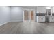 Bright living room featuring stylish gray floors, fresh paint and sliding glass doors to the back yard at 1963 Hogan Ct, Castle Rock, CO 80109
