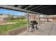 Backyard featuring a grill, covered porch, and a lush grassy area at 3975 S Jason St, Englewood, CO 80110