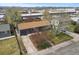 Aerial view of a single-Gathering home with driveway and mature landscaping at 3975 S Jason St, Englewood, CO 80110