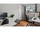 Office space featuring hardwood floors, natural light, and a stylish black leather chair at 3975 S Jason St, Englewood, CO 80110