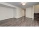 Finished basement with neutral walls and new hardwood floors at 3854 S Olathe Cir, Aurora, CO 80013
