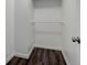Walk-in closet with white walls, and laminate wood flooring at 3854 S Olathe Cir, Aurora, CO 80013